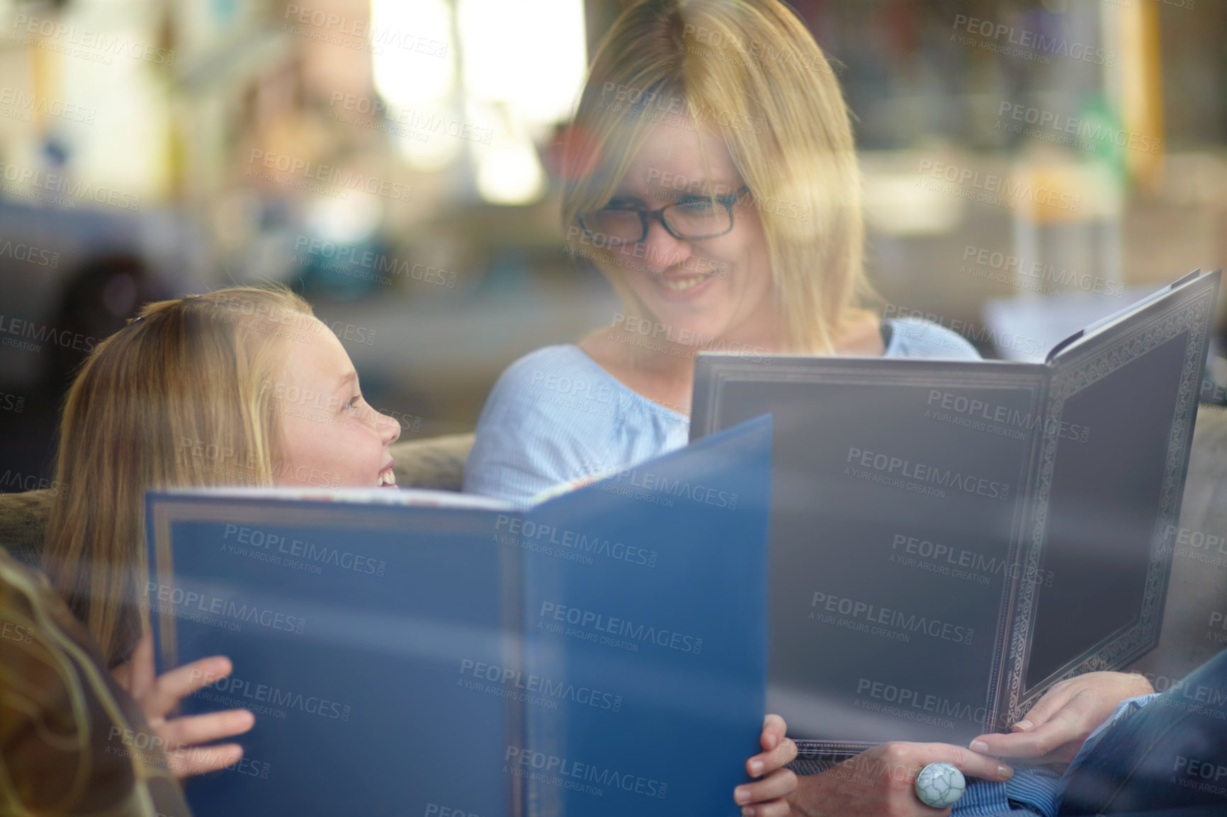 Buy stock photo Reading, books and mother with child in library with smile, learning and relax with study knowledge. Storytelling, happy mom and girl in bookstore together with story, fantasy and education in window