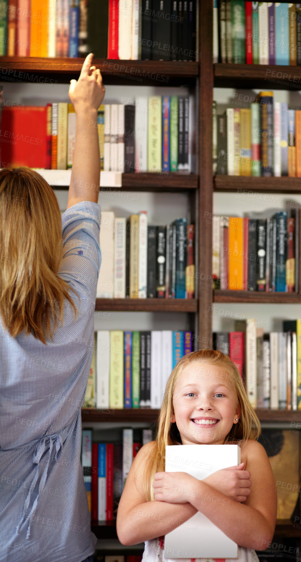 Buy stock photo Portrait, books and child in library with excited smile, learning and relax with study knowledge. Storytelling, happy mom and girl in bookstore together with story, fantasy and education in reading.