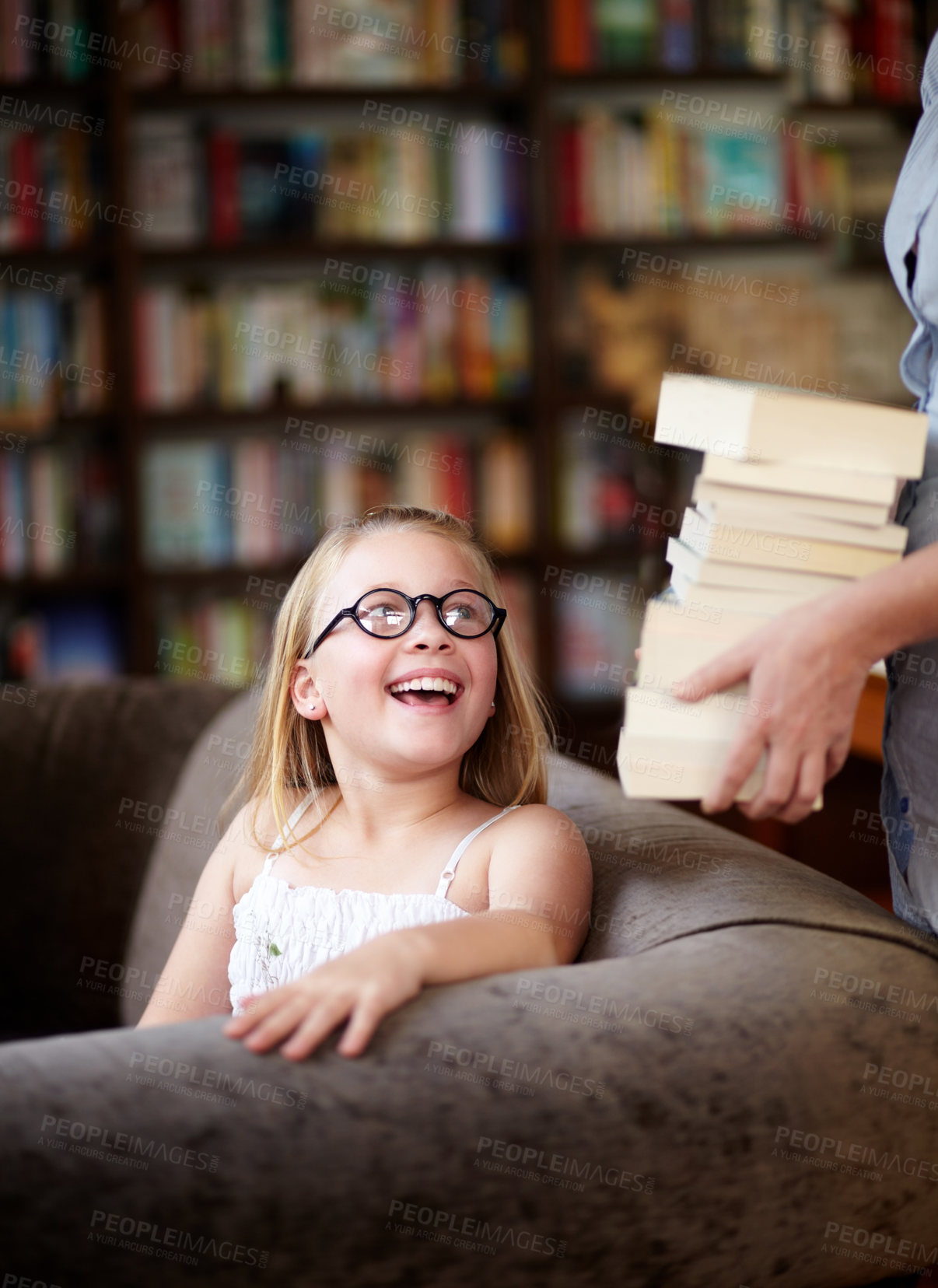 Buy stock photo Smile, stack of books and child in library, learning and relax, studying homework knowledge on couch. School, woman and girl with glasses in bookstore together with story,  and education on sofa.