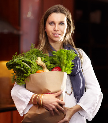Buy stock photo Woman, portrait and vegetable bag in kitchen for nutrition meal, healthy green salad or vegan choice. Female person, face and groceries for eating organic dinner diet, vitamin food or clean spinach