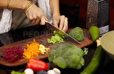 Buy stock photo Cropped image of a woman preparing dinner at home