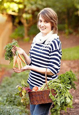 Buy stock photo Portrait, woman and vegetable for harvest with basket for fresh, natural or organic produce for vegan diet. Worker, farmer and smile for carrot, tomato or garden for growth in sustainable development