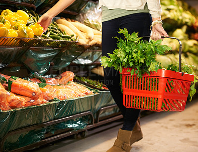 Buy stock photo Cropped image of a woman shopping at the grocery store