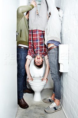 Buy stock photo Nerd, bully and students in a school toilet for abuse, fear or hazing of a victim in a bathroom stall. Portrait, dunk and upside down with a teen boy embarrassed by thugs at university or college