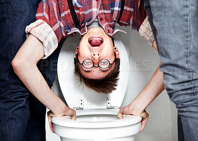 Buy stock photo Closeup portrait of a nerdy guy getting dunked in the school toilet