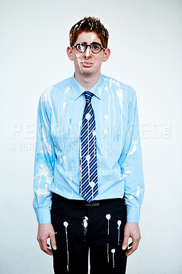 Buy stock photo An unhappy young man covered in bird poop