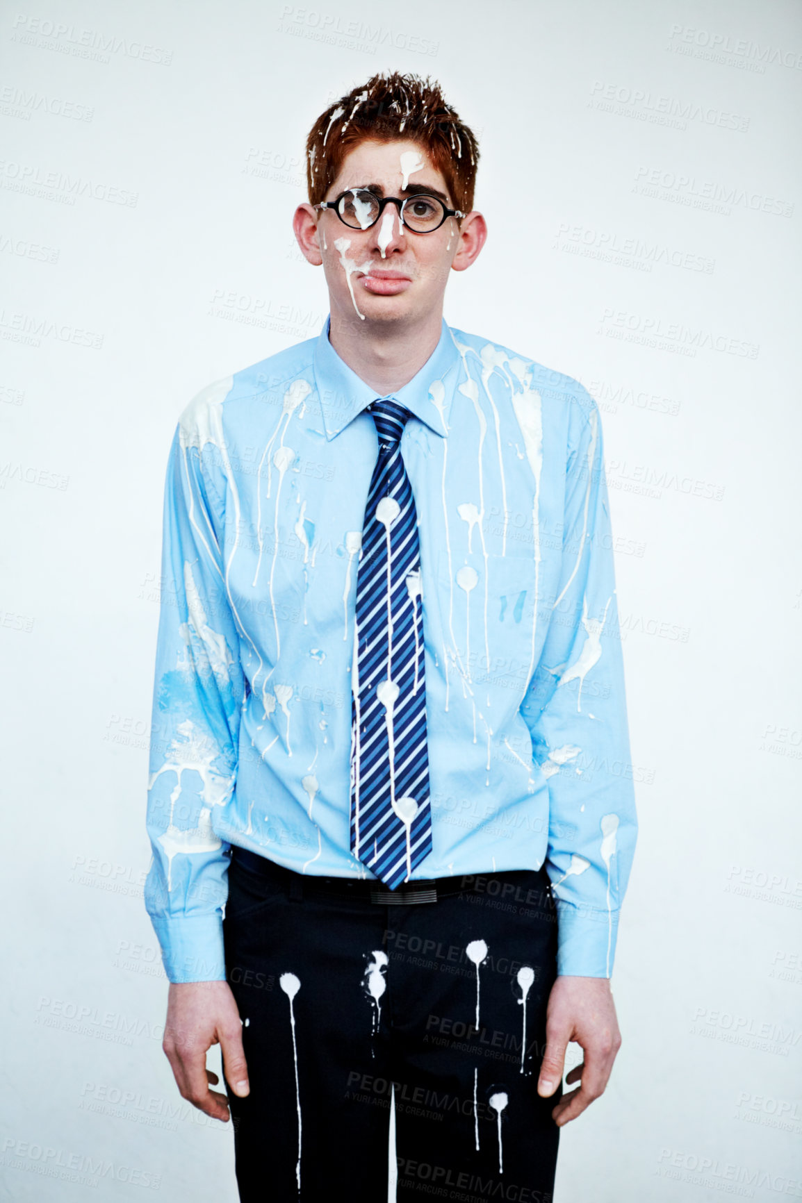 Buy stock photo An unhappy young man covered in bird poop