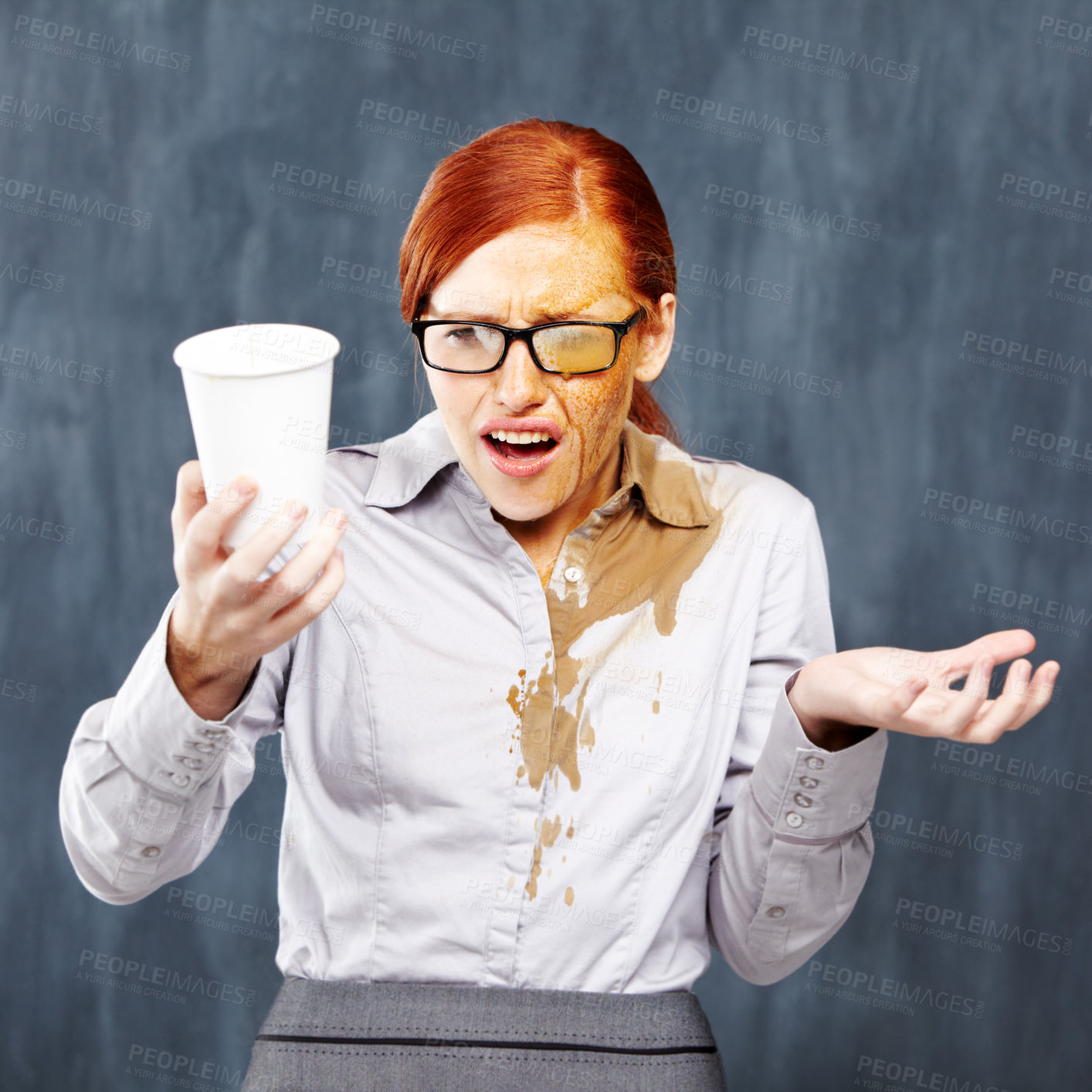 Buy stock photo A young redhead covered in coffee after an unfortunate spillage