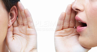 Buy stock photo Cropped image of a one woman telling another woman a secret