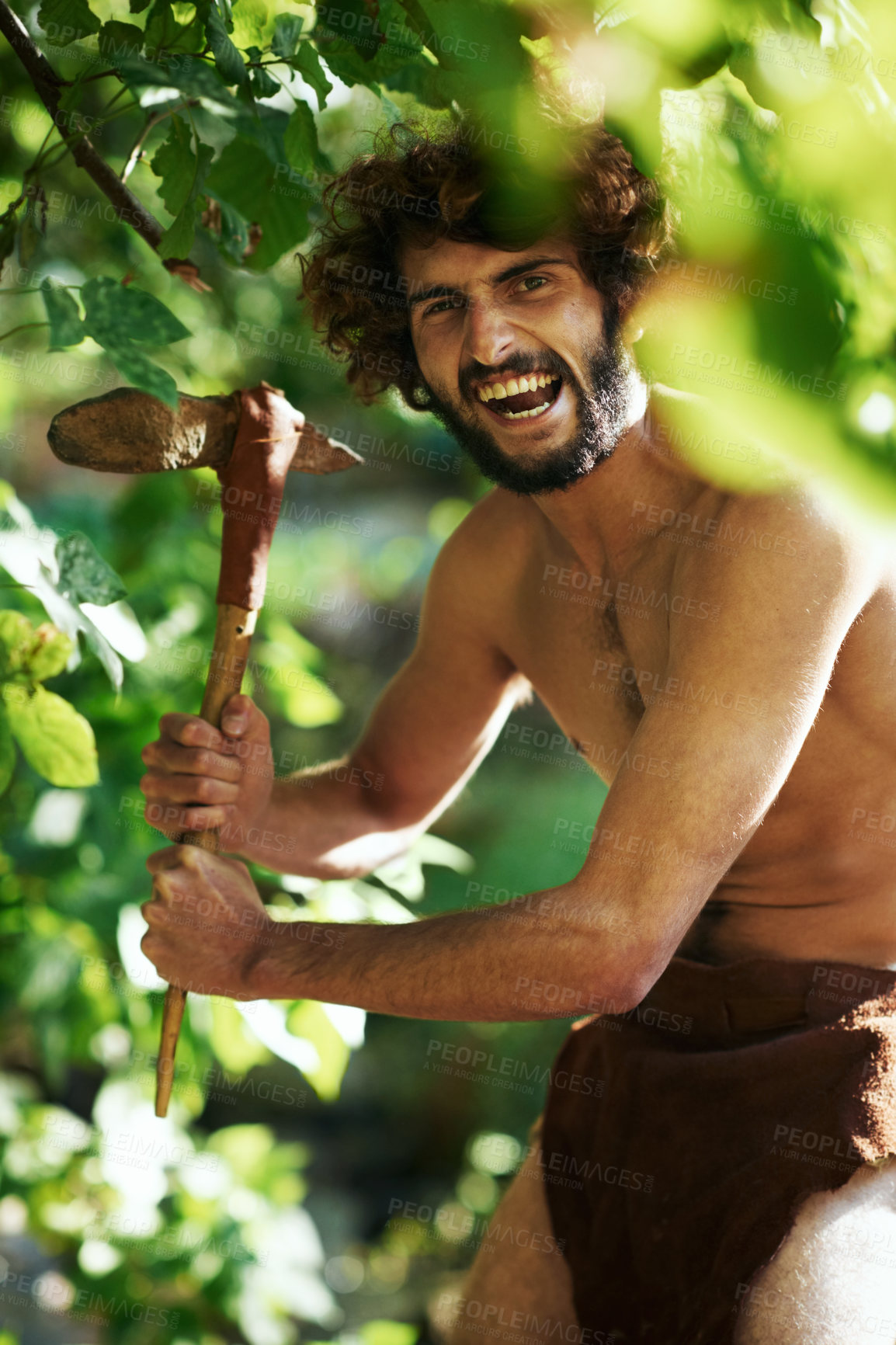 Buy stock photo An aggressive caveman holding an axe