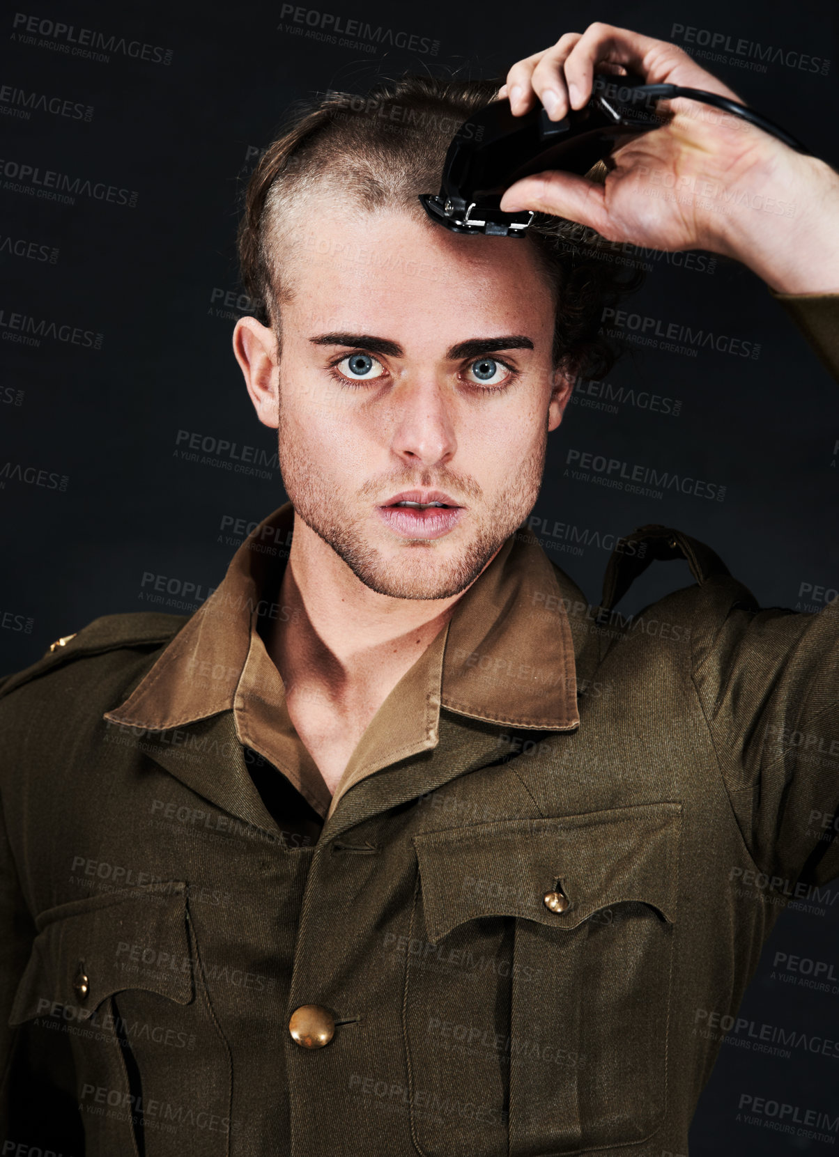 Buy stock photo Military, soldier and portrait of man in haircut at studio isolated on a black background. Army, serious face and person shave hair with machine for grooming to prepare for service, bootcamp and war