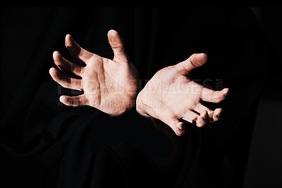Buy stock photo Two hands isolated against a black background
