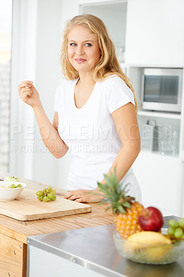 Buy stock photo Fruits, eating grapes or woman thinking of a snack, morning meal or healthy lunch diet in home kitchen. Breakfast idea, vegan or happy girl with fruit salad or food bowl to lose weight for wellness