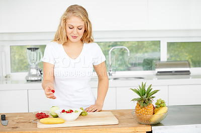Buy stock photo Fruit salad, eating berries or woman with a snack, morning breakfast or lunch diet in home kitchen. Meal, gut health or happy vegan girl with fruits, grapes or food bowl to lose weight for wellness