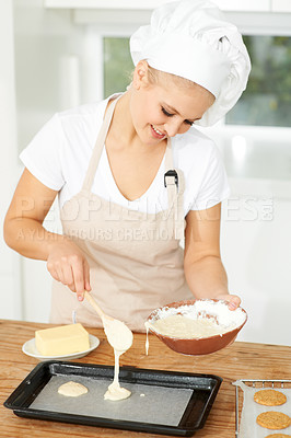 Buy stock photo Happy woman, bakery or chef baking cookies with dough or pastry in a kitchen and is happy decorating his recipe. Food business, dessert or girl baker working in preparation of a sweet meal or biscuit