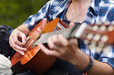 Buy stock photo Guitar, hands and man playing music outdoor, camping and relax with instrument. Musician, guitarist and person closeup with a hobby, skill or talent on adventure, holiday and vacation in summer 