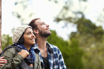 Buy stock photo Couple, hiking in forest with travel and fitness, vacation or date with people in relationship and outdoor view. Environment, trekking and adventure with nature or park, happiness and mockup space