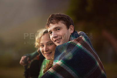 Buy stock photo Couple, outdoor and cold for adventure, closeup and cold together with blanket, enjoying and camping. Smile, man and woman for quality time, happiness and relationship with romance, bonding and hug
