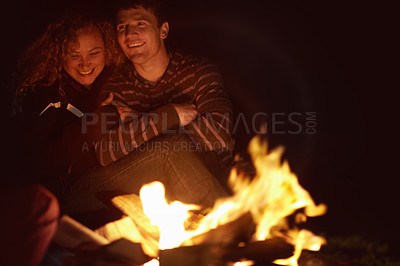 Buy stock photo Couple, fire and camping, travel and outdoor in nature, warm up and winter, relax together with love and vacation. Camper people, flame for heat and freedom, campsite adventure with bonding and happy