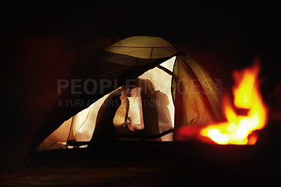 Buy stock photo Silhouette view of a young couple kissing in a tent