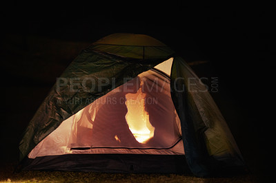 Buy stock photo Couple, tent and night camping for kiss, adventure and fire for romance, enjoy and sitting. Travel, people and silhouette for quality time, happy and relationship with bonding, romantic and campsite
