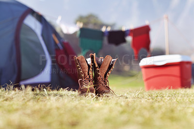 Buy stock photo Outdoor, hiking boots and laundry in campsite, tent and clean for camping, clothes line or park. Washing, sunrise and nature for travel, adventure and holiday for vacation, campers and environment
