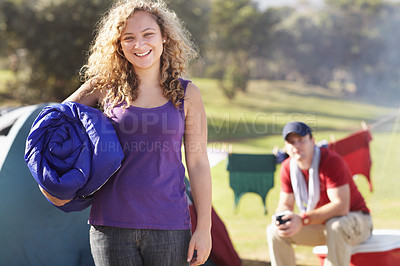 Buy stock photo Camper, woman in portrait and sleeping bag, adventure and holiday with happiness in nature outdoor. Camping, travel and recreation in forest, campsite with equipment or gear to sleep, smile and relax