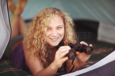 Buy stock photo Woman, binocular and tent for camping, campsite and smiling for nature, adventure and holiday. Travel, leisure and portrait for vacation, happiness and break with face, relaxing and enjoying alone
