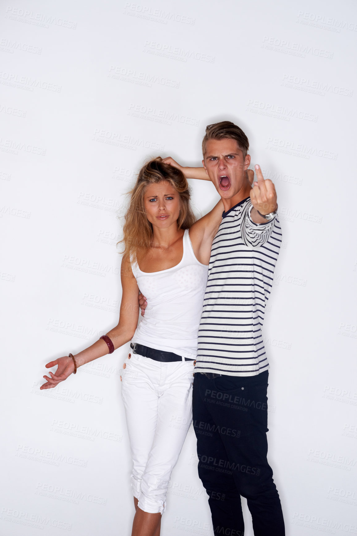 Buy stock photo Fashion, middle finger and portrait of couple on a white background with trendy clothes, style and outfit. Angry, upset and isolated man and woman in studio with confidence, attitude and emoji