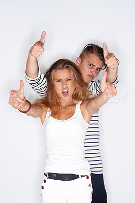 Buy stock photo Fashion, pointing and portrait of couple on a white background with trendy clothes, style and cool outfit. People, aesthetic and isolated man and woman in studio with confidence, attitude and pride