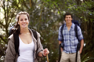 Buy stock photo Portrait of a young woman with her boyfriend in the background