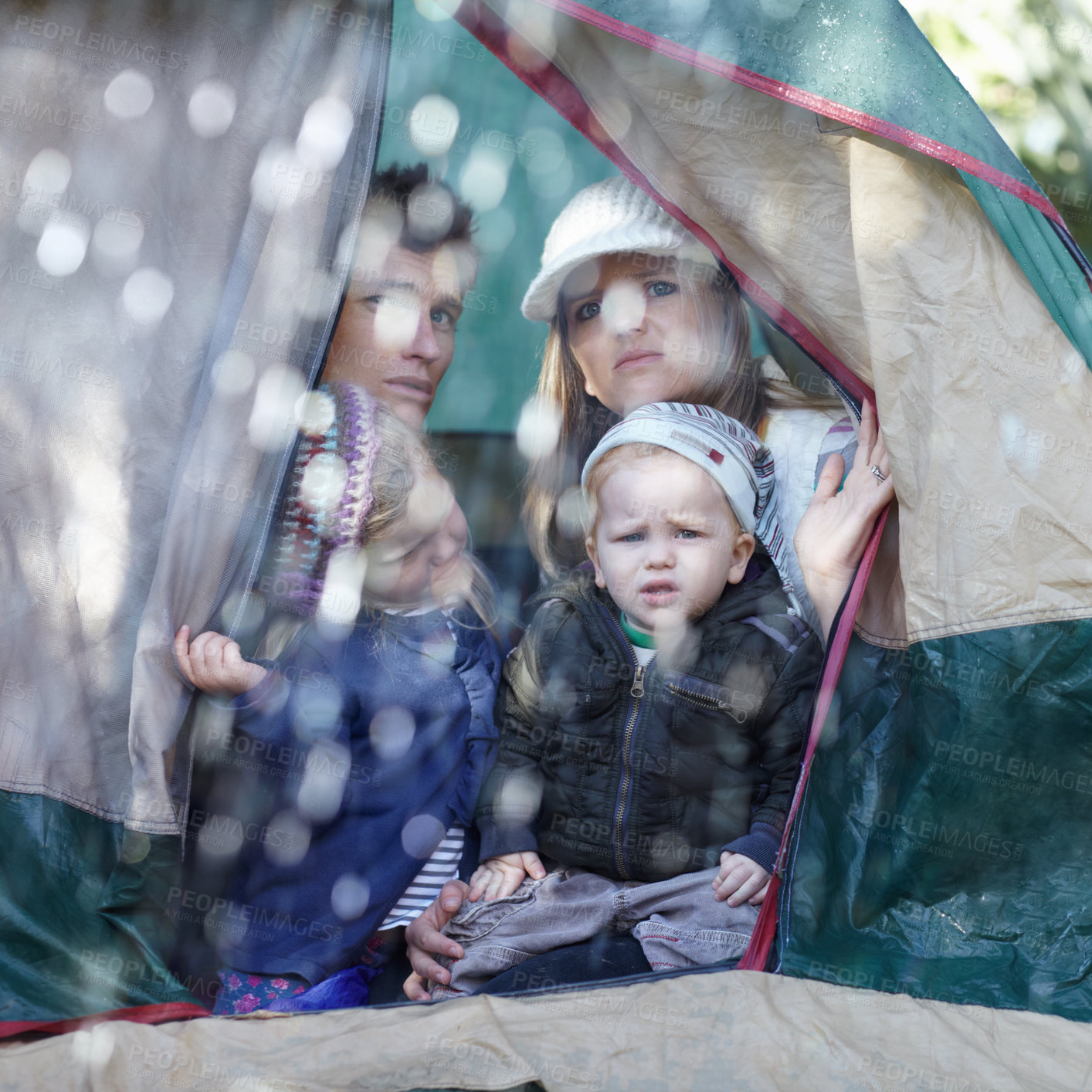 Buy stock photo Camping, family and parents with children in rain sad for adventure, holiday and vacation in winter outdoors. Disappointed, unhappy and mother, father and kids in tent with bad weather for travel