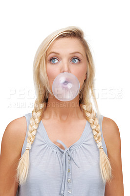 Buy stock photo A young blonde woman blowing a bubblegum bubble