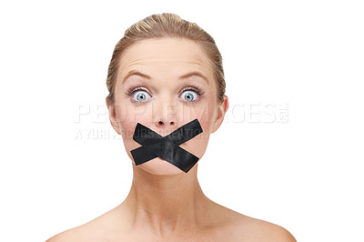 Buy stock photo A young blonde woman looking shocked with duct tape covering her mouth