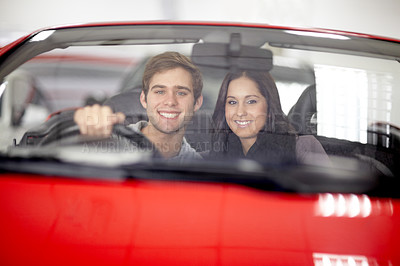 Buy stock photo Smile, dealership and portrait of couple in a car after a purchase together for romance. Happy, love and young man and woman from Canada buying new vehicle for relationship in showroom for transport.
