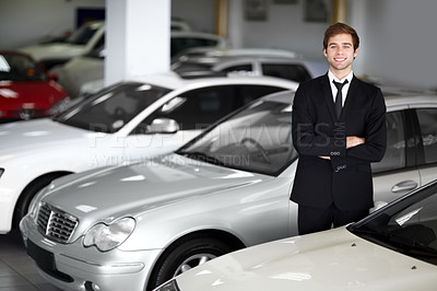 Buy stock photo Cars, crossed arms and portrait of salesman at dealership with smile, transport and sales job. Professional, vehicle for driving and employee with career, happiness and selling transportation.