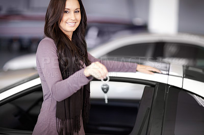 Buy stock photo Key, dealership and portrait of happy woman with a car for purchase with positive, good or confident attitude. Happy, driving and female person from Canada in a new vehicle in showroom for transport.