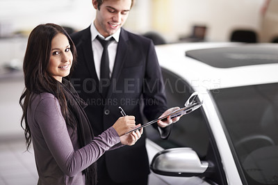 Buy stock photo Car dealership, woman and man with contract for deal, sale and sign for payment with smile in portrait. Girl, paperwork and happy for signature with legal agreement, loan and compliance for vehicle