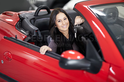 Buy stock photo Key, dealership and portrait of woman in a car for purchase with positive, good or confident attitude. Happy, driving and young female person from Canada in a new vehicle in a showroom for transport.