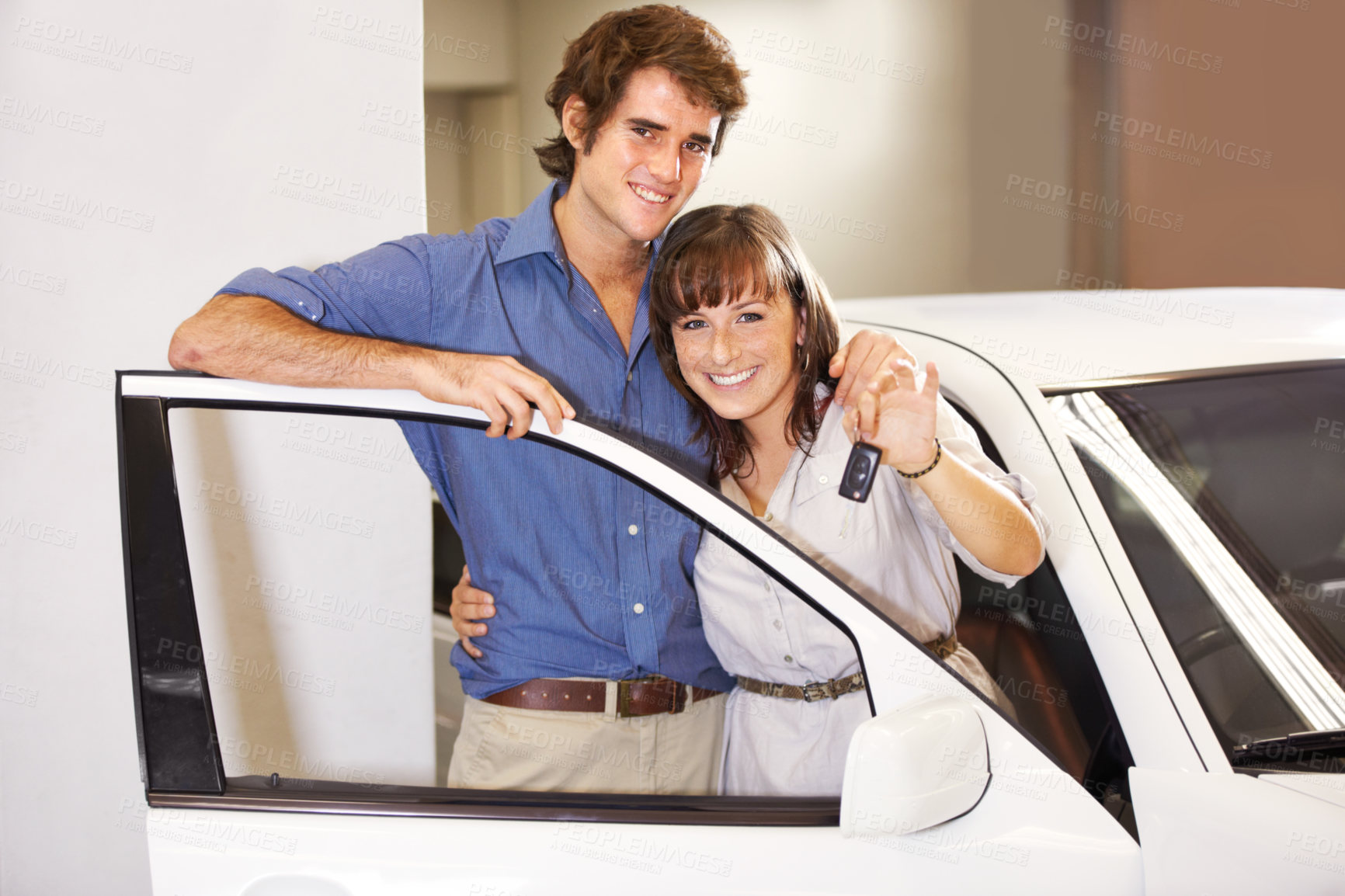 Buy stock photo Key, dealership and portrait of couple in a car after a purchase together for romance. Smile, happy and young man and woman from Canada buying new vehicle for relationship in showroom for transport.