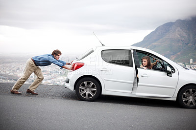 Buy stock photo Travel, breakdown and a couple pushing a car on the street after a vehicle accident or roadside problems. Road trip, transport issue or trouble with a man and woman in the countryside for vacation