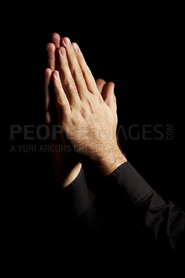 Buy stock photo Prayer, hands and black background for hope, religion and faith or ask for help with worship or spiritual support in studio. Praying emoji, christian person and God, forgive or humanity in dark room