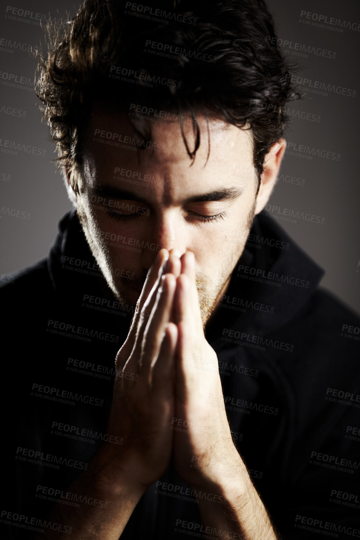 Buy stock photo Hands, pray and man praise God with gratitude and respect for religion on grey background. Guide, wellness and prayer, worship and faith, hope and trust with belief and healing from grief in a studio