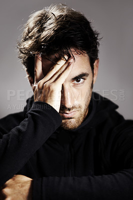 Buy stock photo Sad, portrait and a man with depression on a studio background for mental health or mindset. Stress, frustrated and a person with anxiety, fail or a mistake with a disaster or crisis on a backdrop