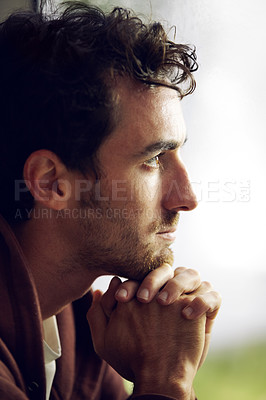 Buy stock photo Thinking, sad and a man looking depressed with a mental health problem, depression or anxiety. Fail, young and a guy sitting with thoughts of worry, stress and unhappy in a house, lonely and grieving