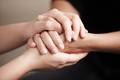 Buy stock photo Cropped shot of two people holding hands in comfort