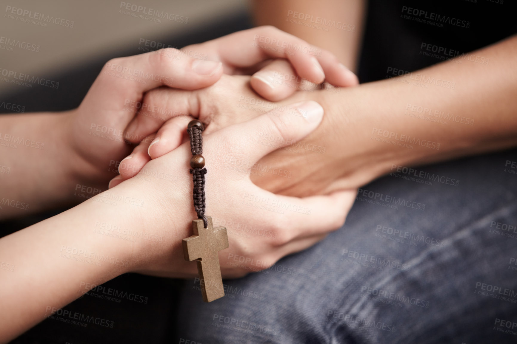 Buy stock photo Holding hands, prayer together with beads and help for religion, trust and spiritual hope. Support, counseling and people in Christian meeting for faith, worship or empathy with rosary, cross and God