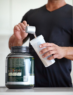 Buy stock photo Man, hands and preparing whey protein shake for nutrition, muscle gain or body mass supplement. Hand of male bodybuilder making pre workout or powder drink product for exercise, diet or healthy meal
