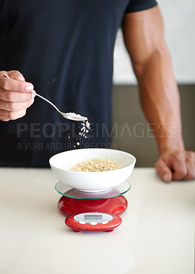 Buy stock photo Scale, food and man weigh oats in kitchen to measure portion for calories, nutrition and balanced diet. Cooking, meal prep and hands of male person with breakfast bowl for healthy eating at home