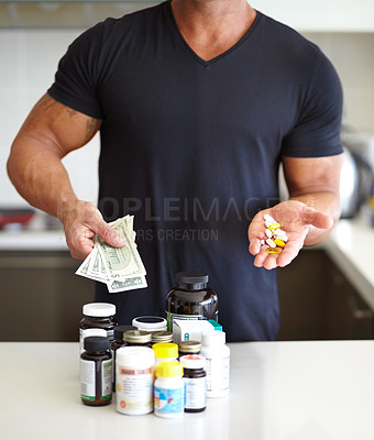 Buy stock photo Closeup, cash and man with pills, supplements and vitamins at home, growth and muscle development. Zoom, male person and healthy model with fitness, money and medicine for body care, drugs and bills
